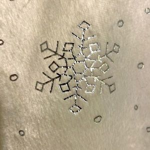 White snowflake tree skirt